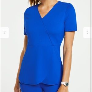 Jaanuu mock wrap tulip scrub top in royal blue
